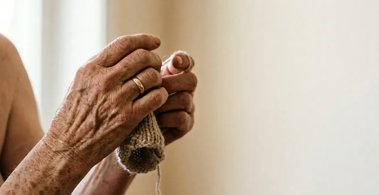 Close-up of senior hands gently moving in natural light, showing tactile warmth and careful motion, symbolizing the therapeutic value of movement over rest for arthritic joints